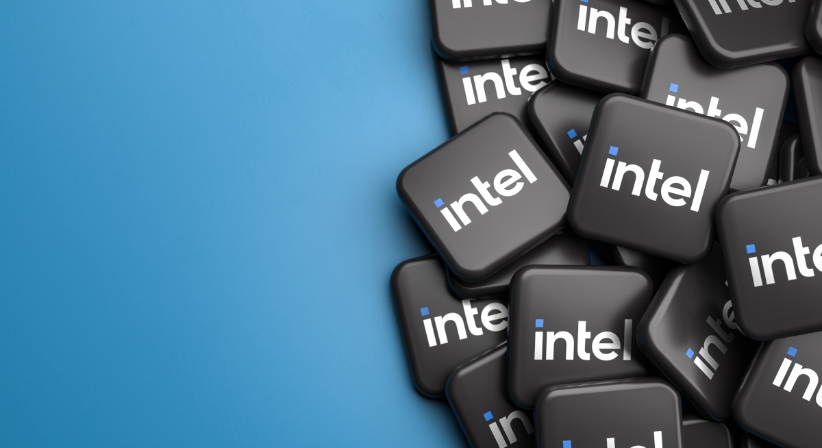 The Intel logo in white on black tiles against a blue background.