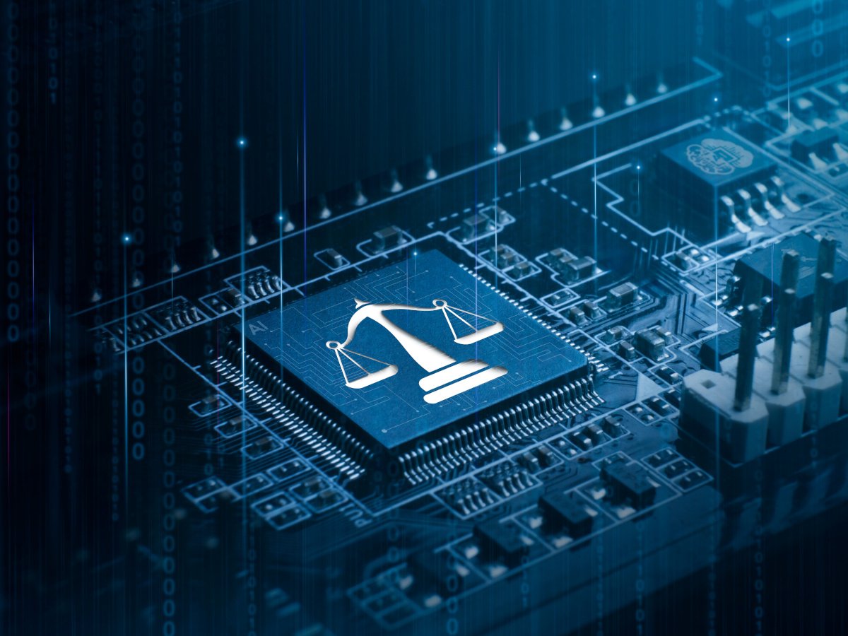 A digital image of a circuit board with the scales of justice printed on it.