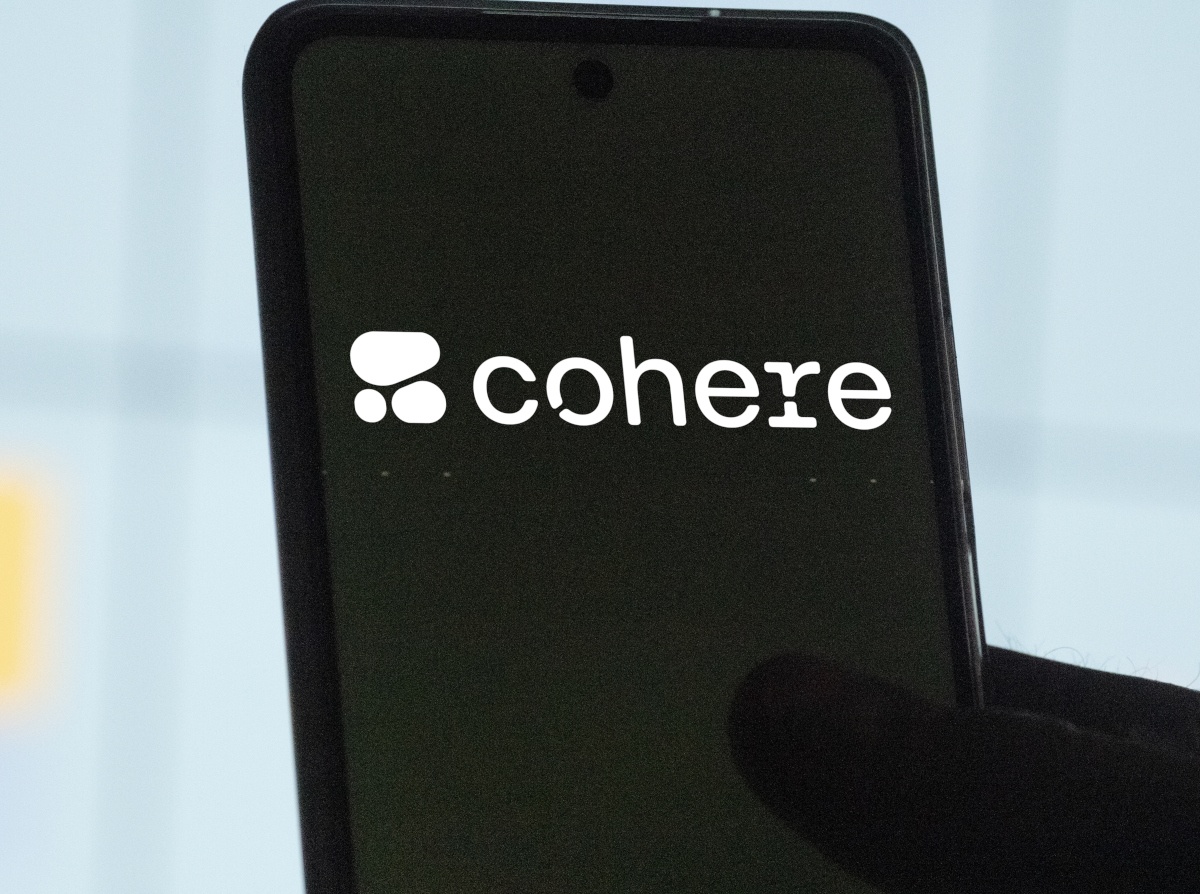 Cohere logo on black smartphone screen.