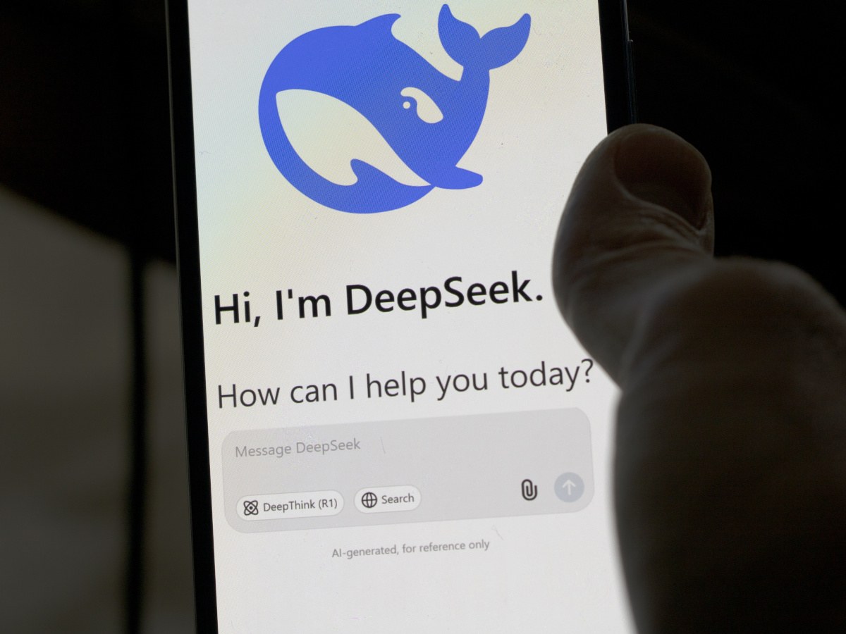 A picture of a phone displaying the DeepSeek AI chatbot homepage.
