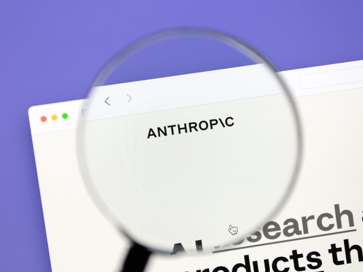 Lavender background, with a magnifying glass focusing on the