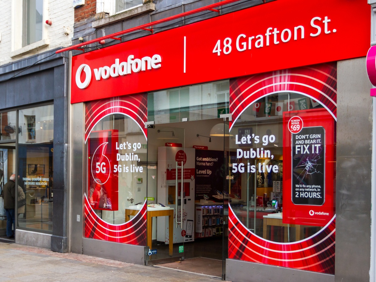 The red shopfront of a Vodafone retail store on Dublin