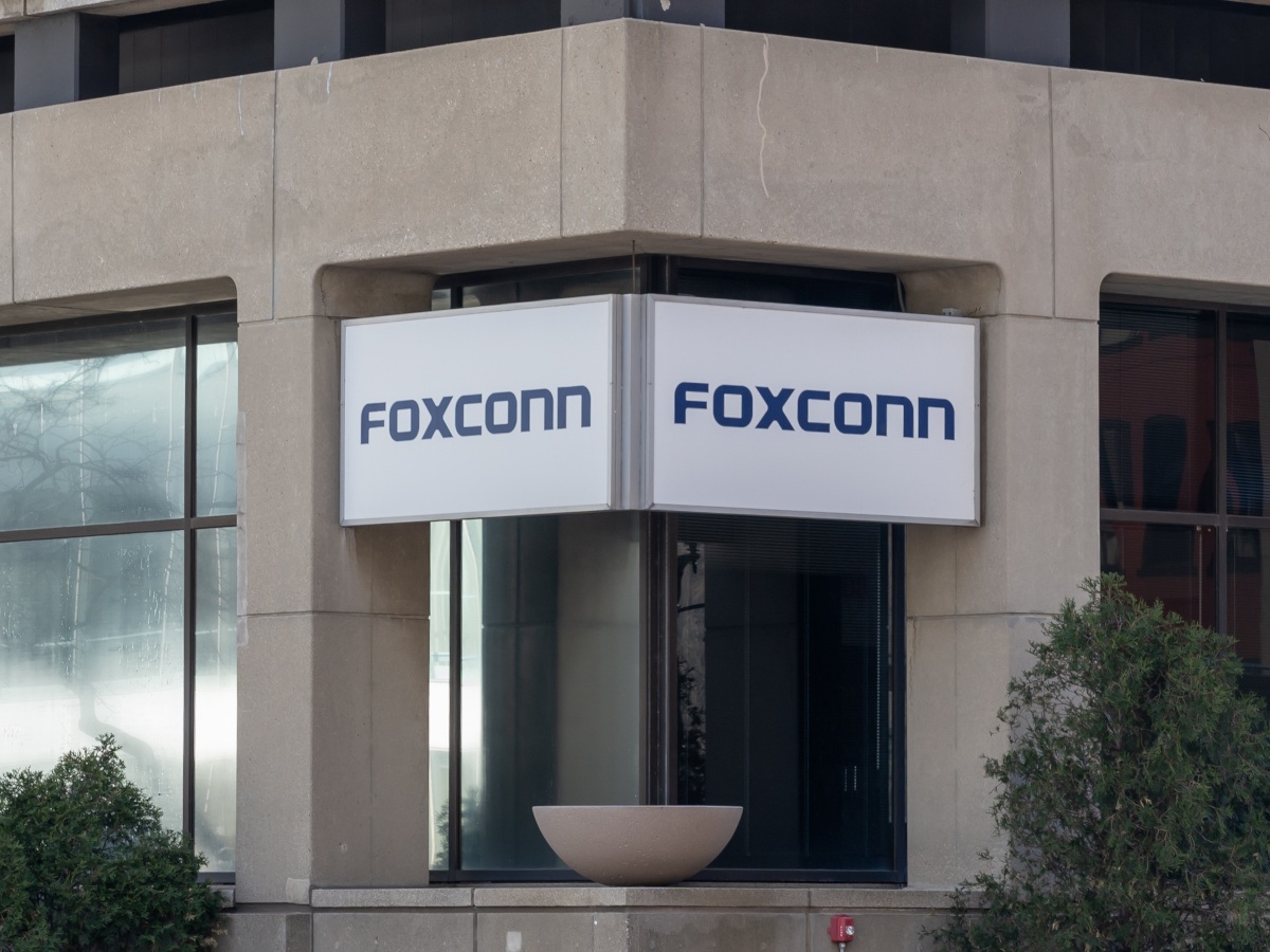 A picture of a double-sided Foxconn sign stretching over a building corner in Wisconsin.