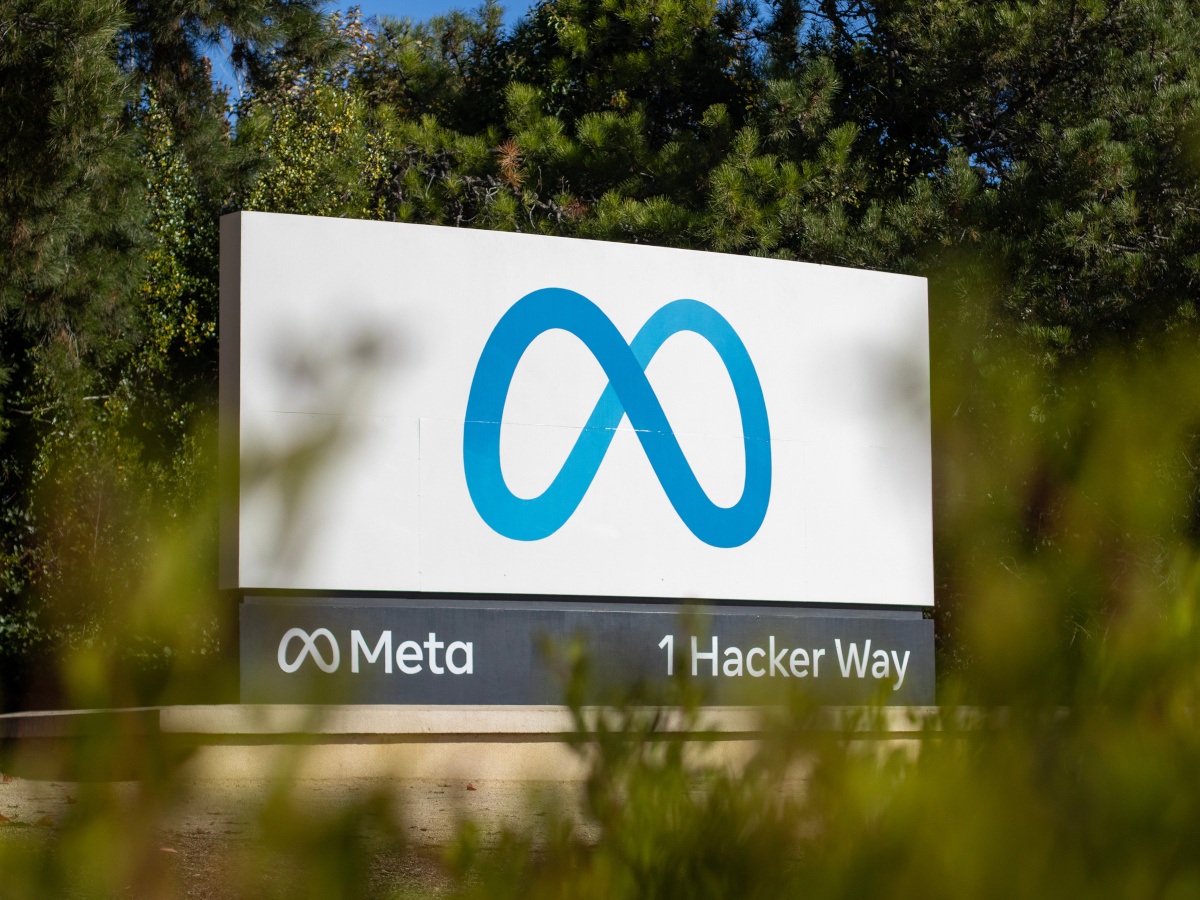 Meta company sign on a white background outside during daylight.