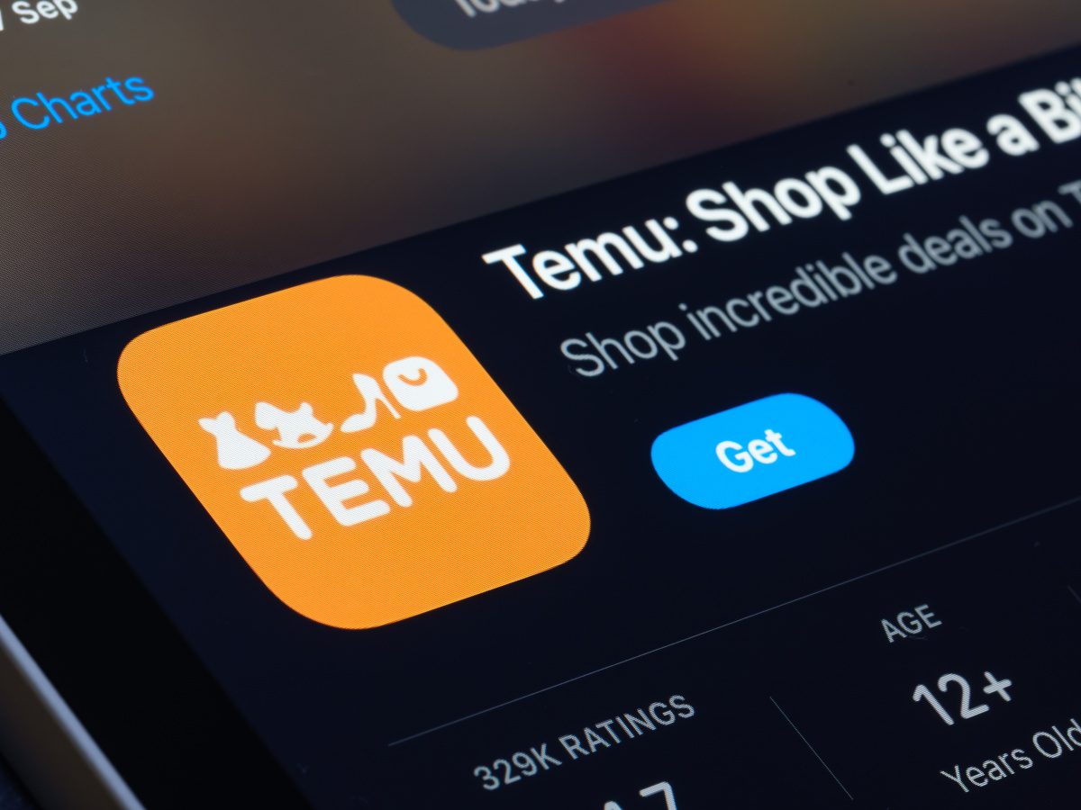 A close up picture of a phone screen on the Apple App Store page for Temu.
