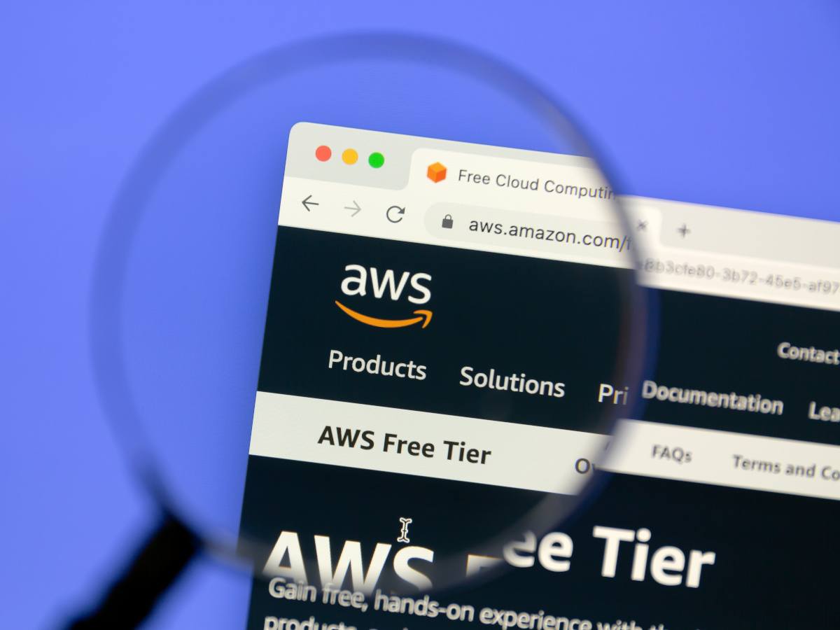 AWS website with a magnifying glass placed over the logo.