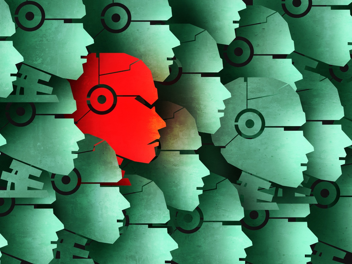 A red AI face among several green faces emphasising the rogue AI