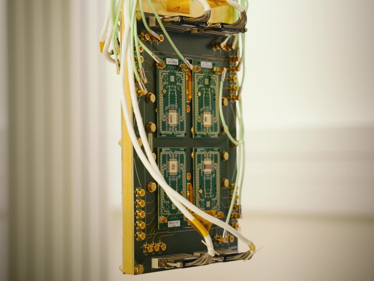 A circuit-board-looking piece of equipment with thin wires attached to it.