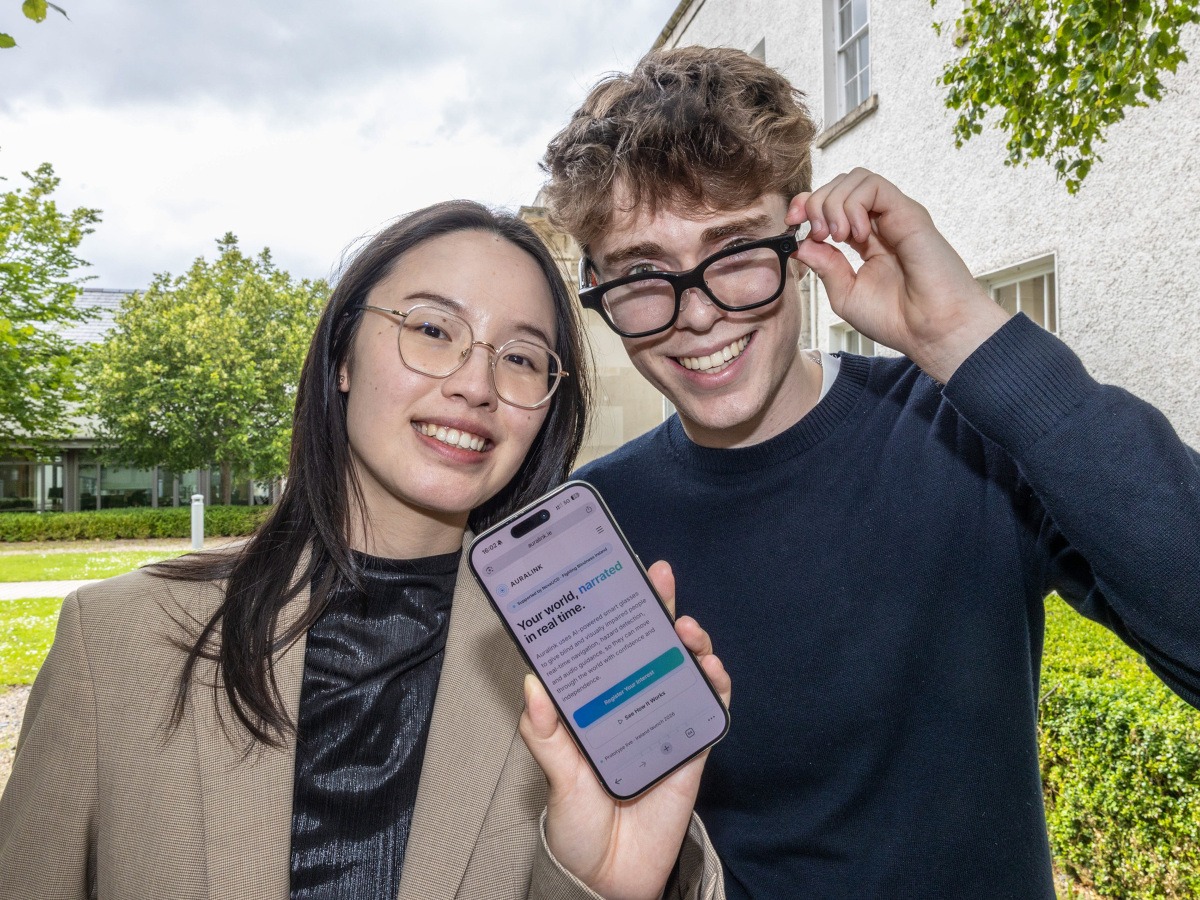 A young woman to the left holding up a smart phone and a young man to her right wearing smart glasses.