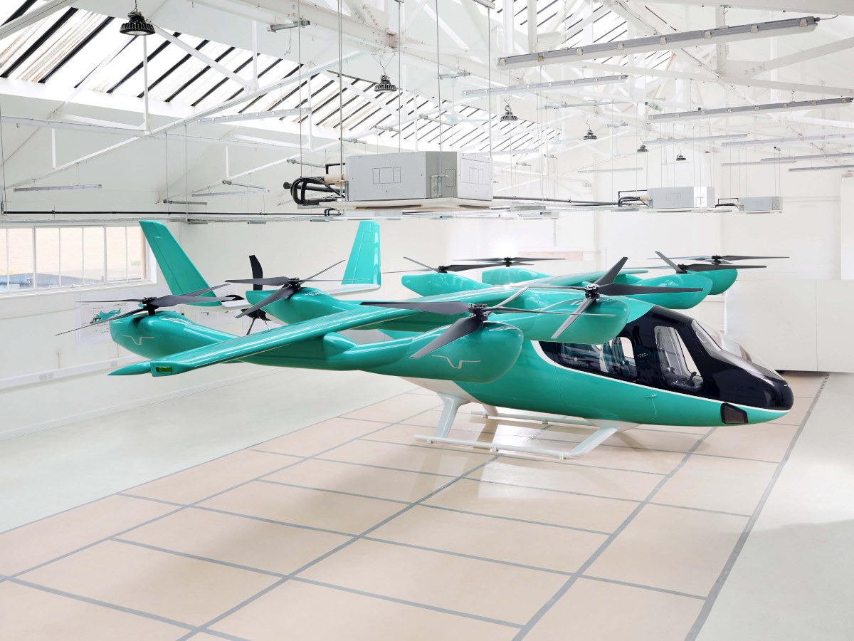 A blue aircraft that looks similar to a sea plane but for land.