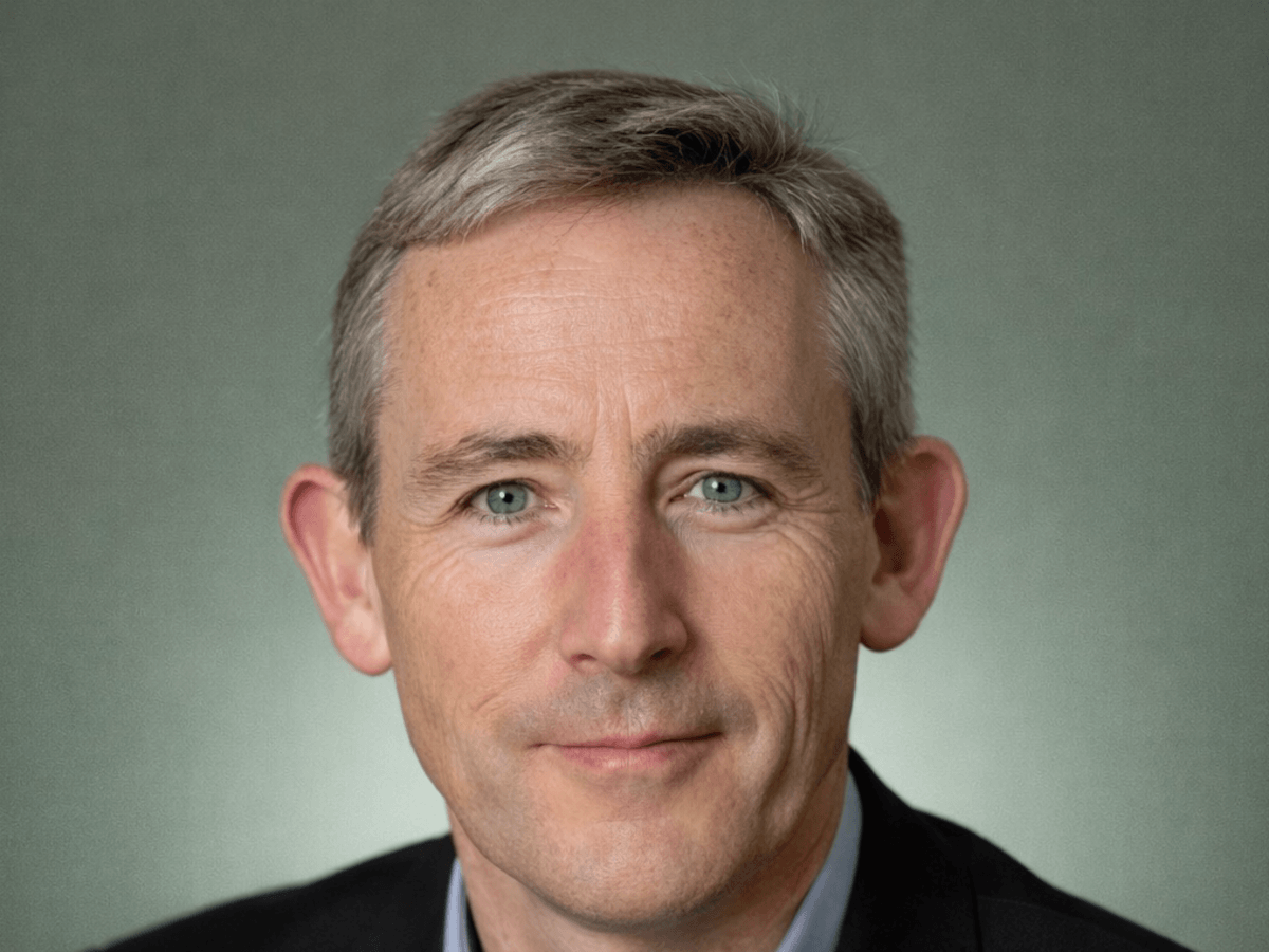Close-up portrait of white man with short grey hair.
