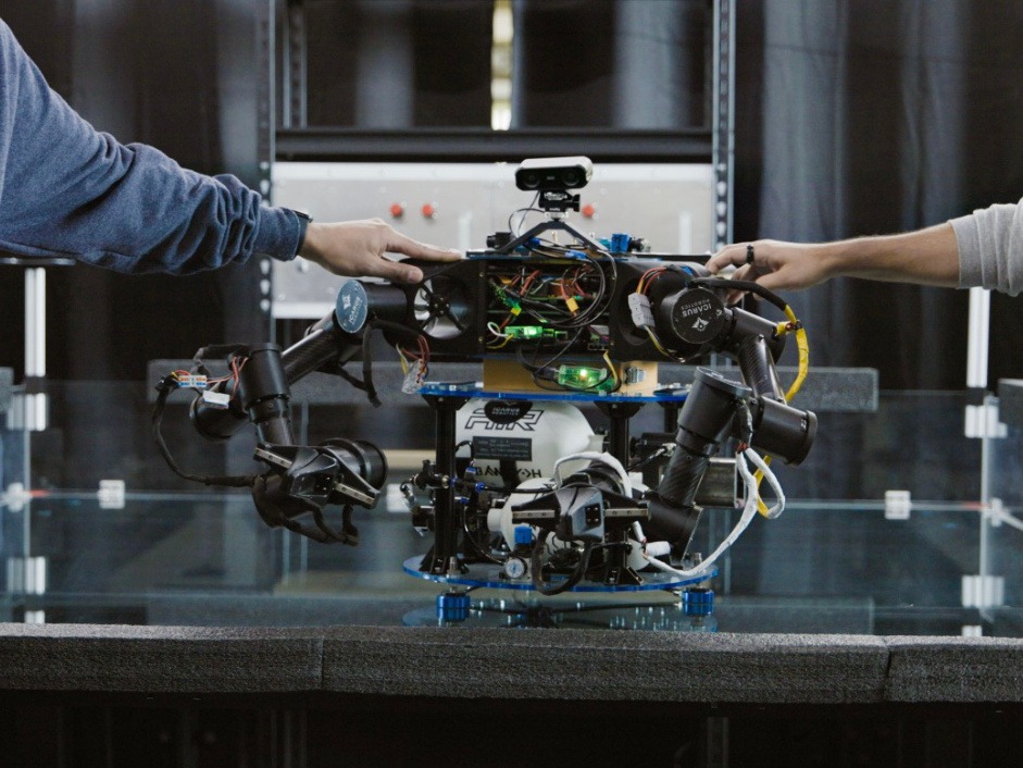 A small robot with wires and components showing.