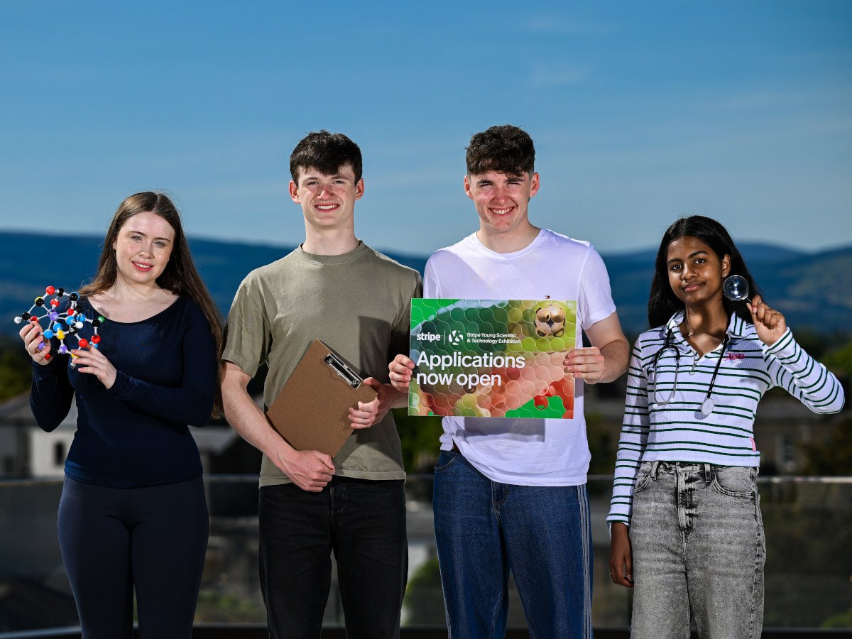 Four young people standing holding their projects.