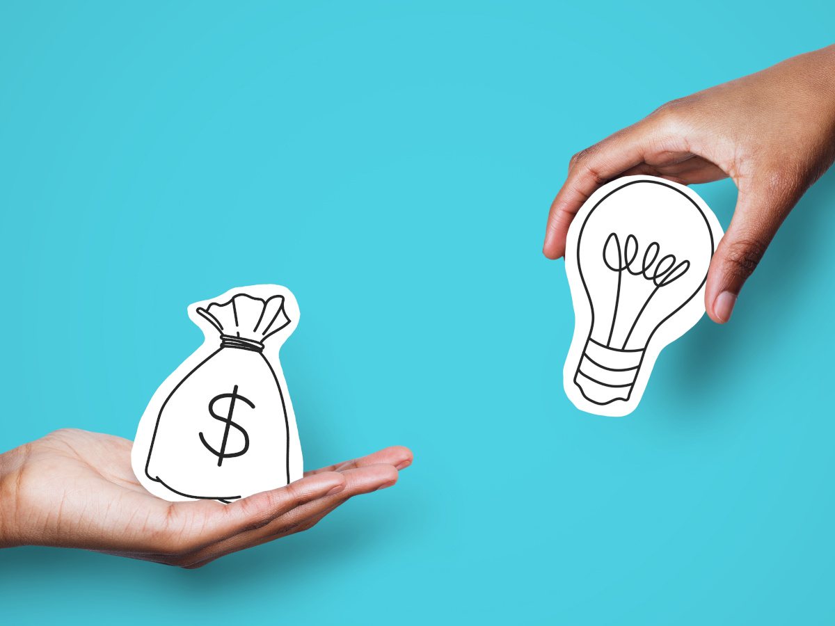 A hand reaches out with money towards a hand with a lightbulb signifying an idea, all against a background.