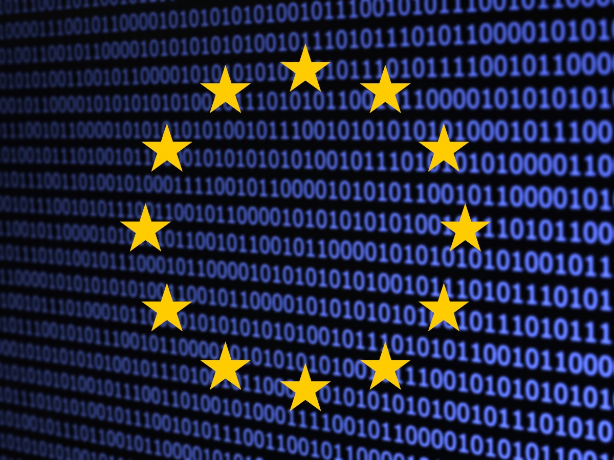 A digital image of the EU flag, where the blue behind the stars is made up of blue binary text over a dark screen.