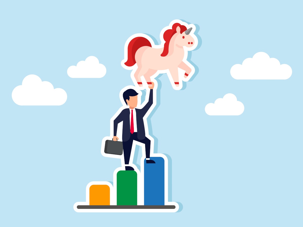 A cartoon business man on top of rising charts holding a unicorn.