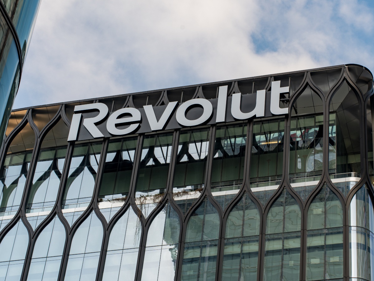 The Revolut logo on a black, glass building.