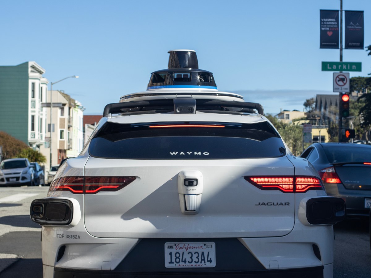 Back of a Waymo robotaxi on the street.