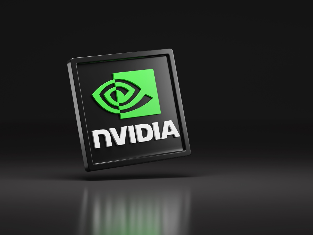 The green Nvidia logo on a black semiconductor chip.