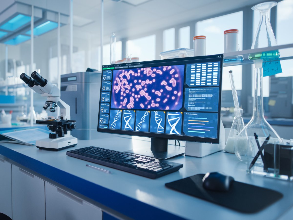 A laboratory with a computer screen showing genomes.