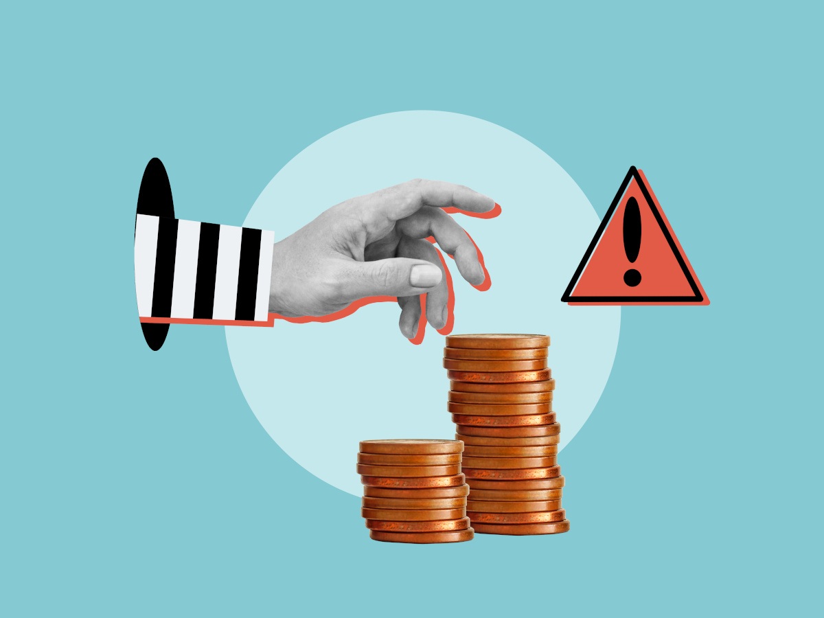 A hand coming out of a hole attempting to steal coins.