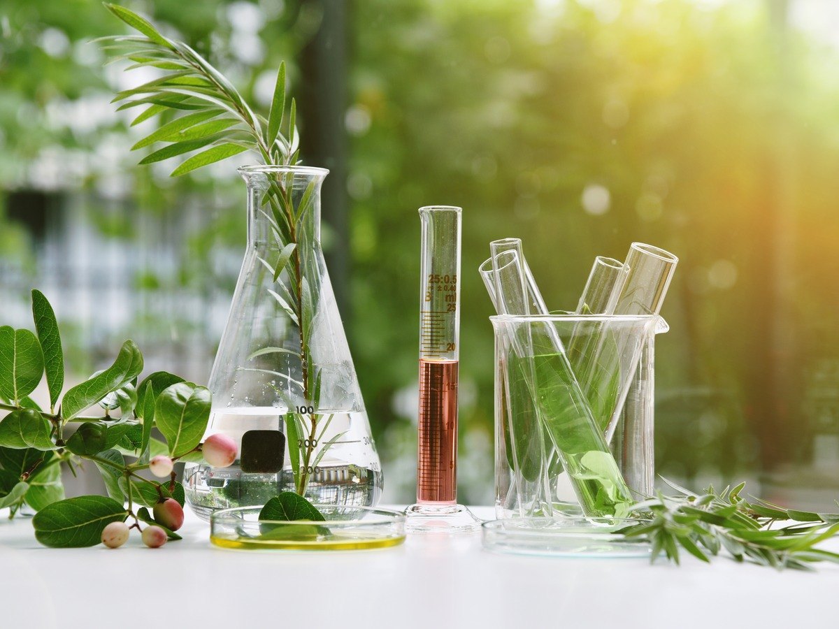 Lab and research equipment on a table in a green area.