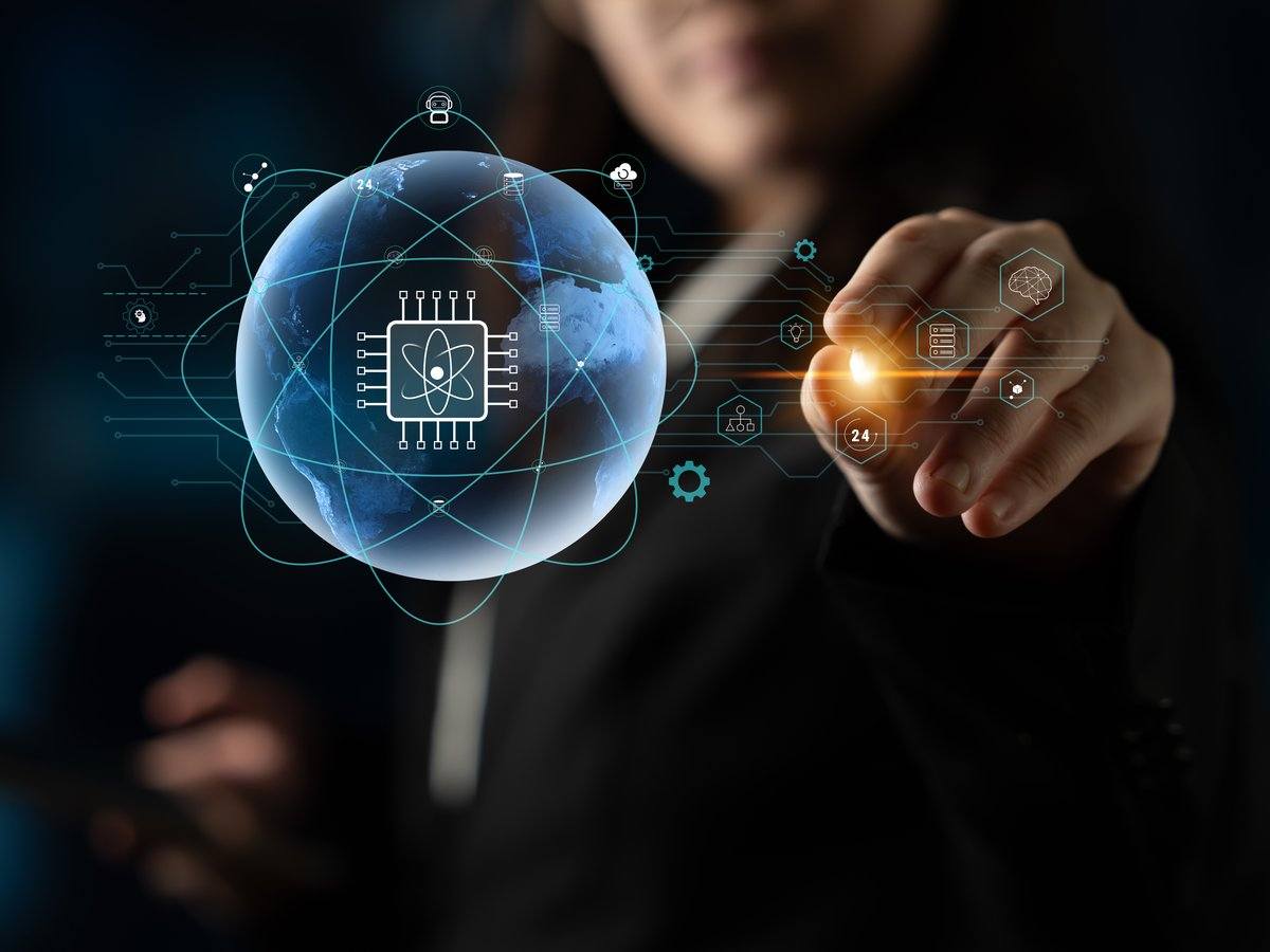 A woman reaches out and touches a glowing ball representing quantum.