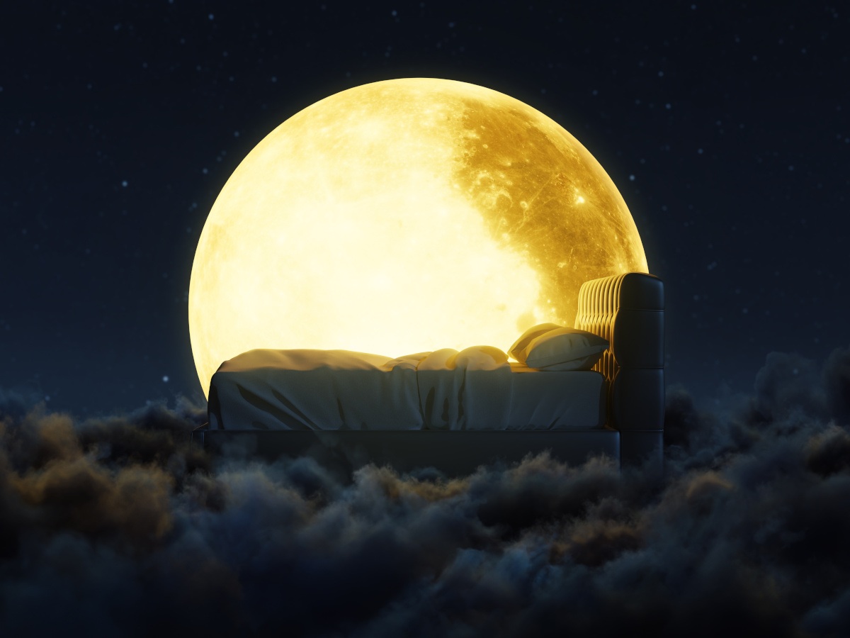A 3D rendering of a bed lying on a group of clouds with a bright yellow moon in the background, surrounded by space.