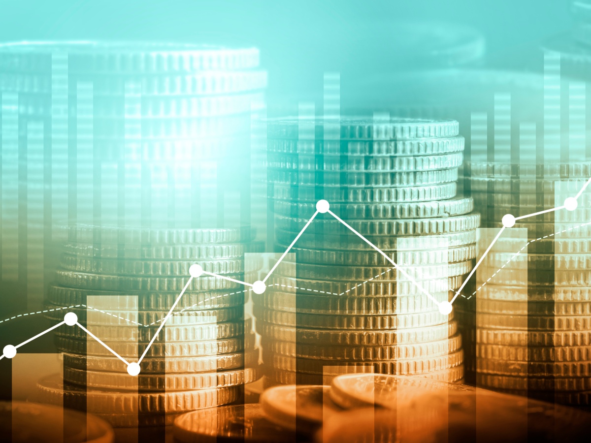 A digital image of a bar chart overlaid on a picture of Euro coins.