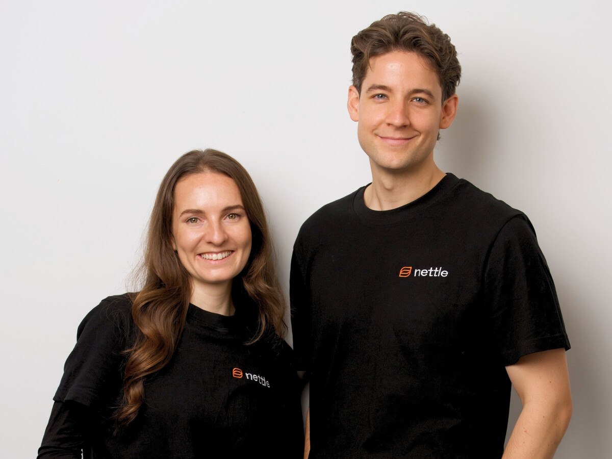 A woman to the left and a man to the right in a black t-shirt.
