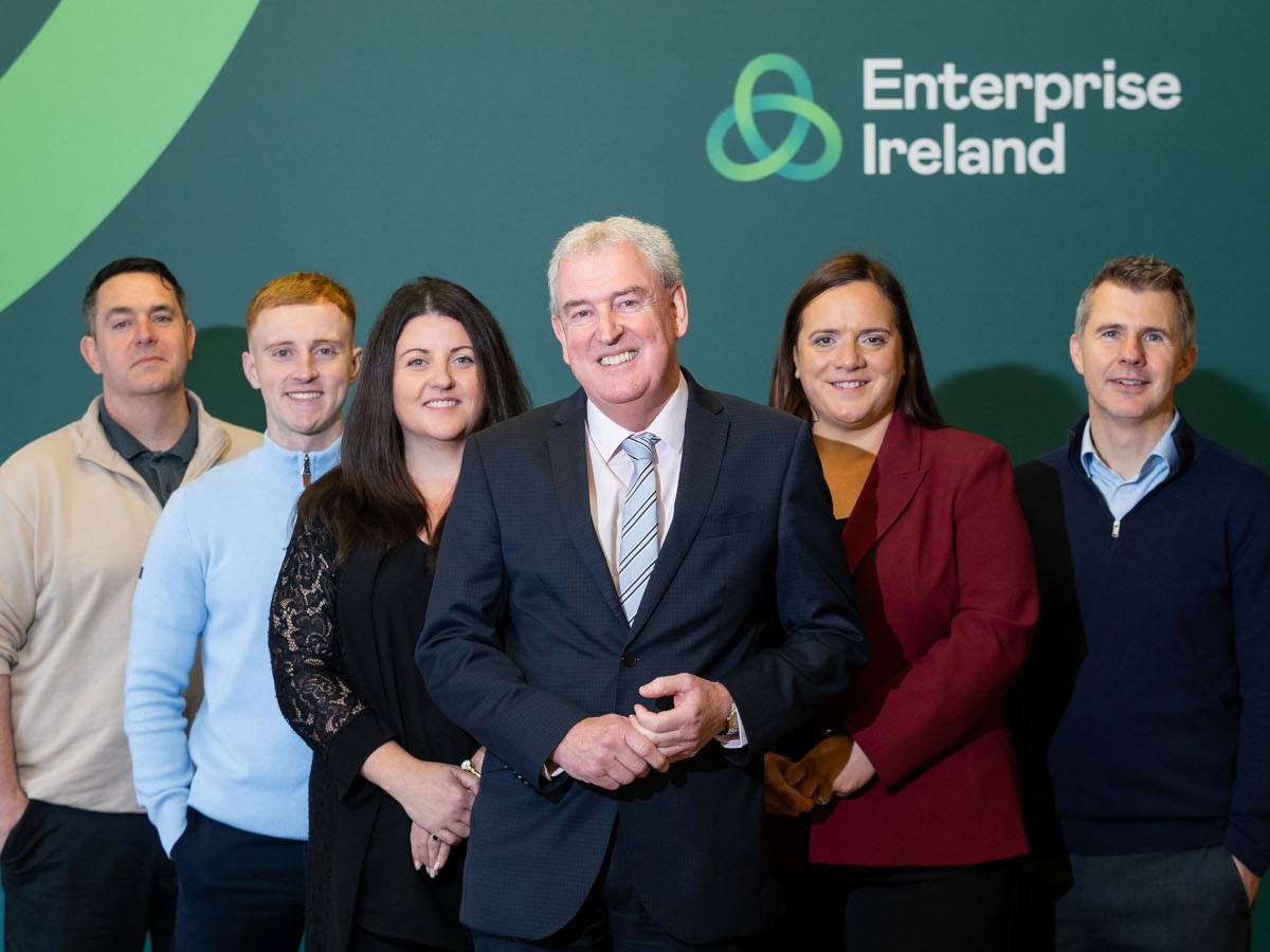 Six gender and age diverse people in business attire at the Enterprise Ireland HPSU awards.