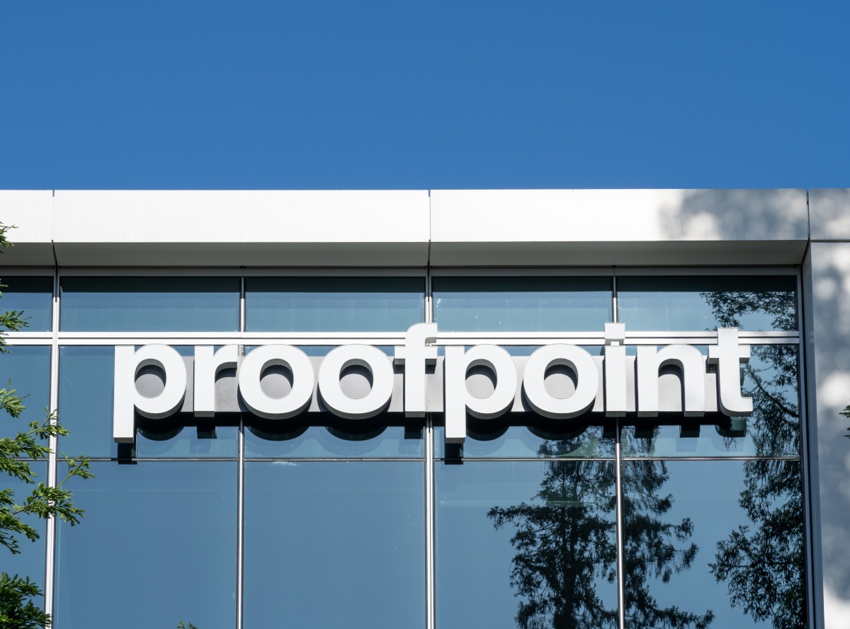 Proofpoint signage on modern building with blue skies.