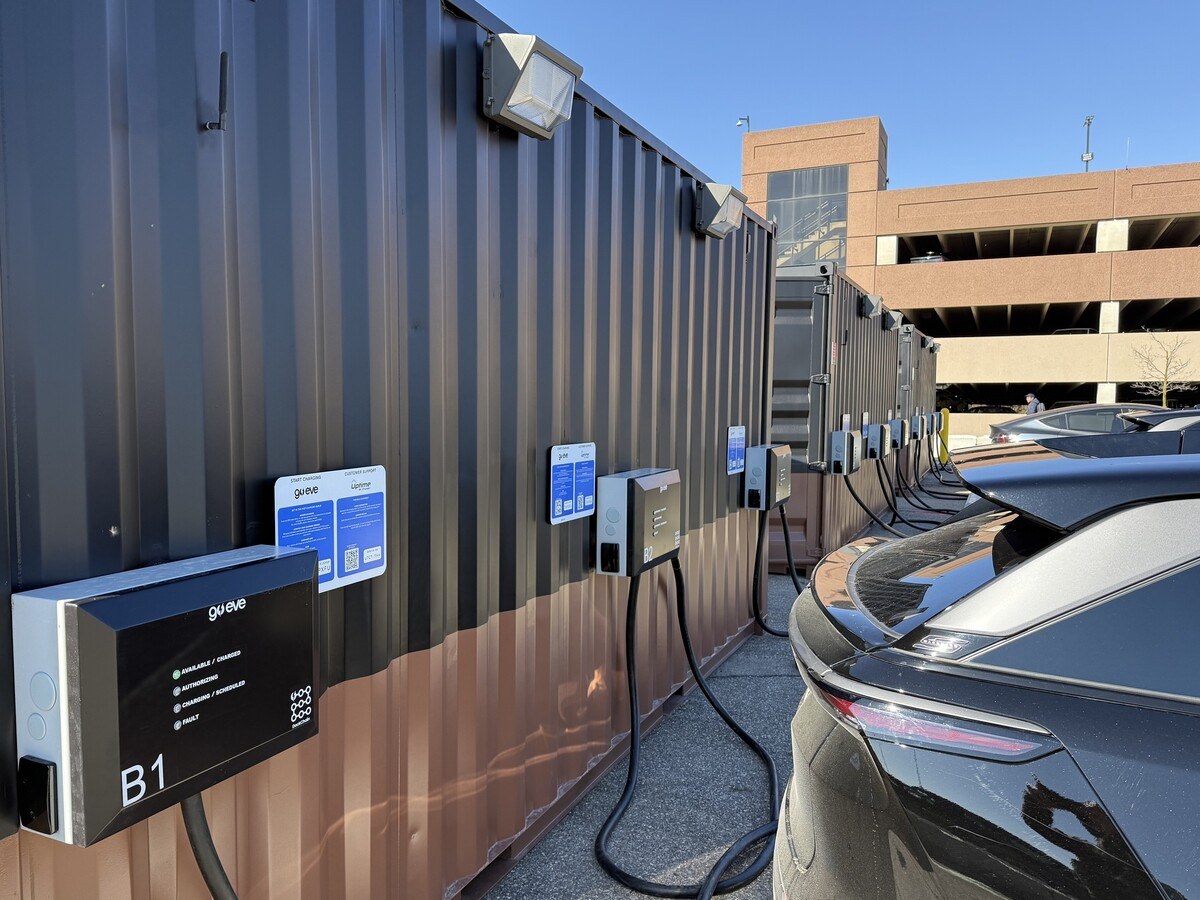 An EV charging dock station with cars plugged to it.